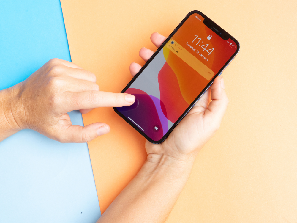 Two hands holding a phone